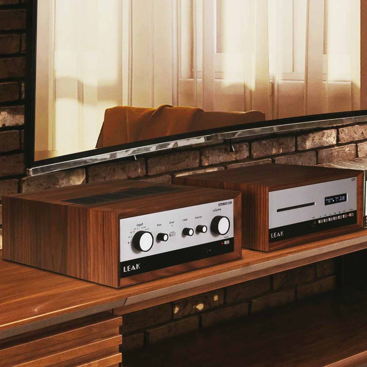 Leak Audio Stereo 230 Integrated Amplifier - Walnut - lifestyle shot of unit on shelf next to Leak CDT
