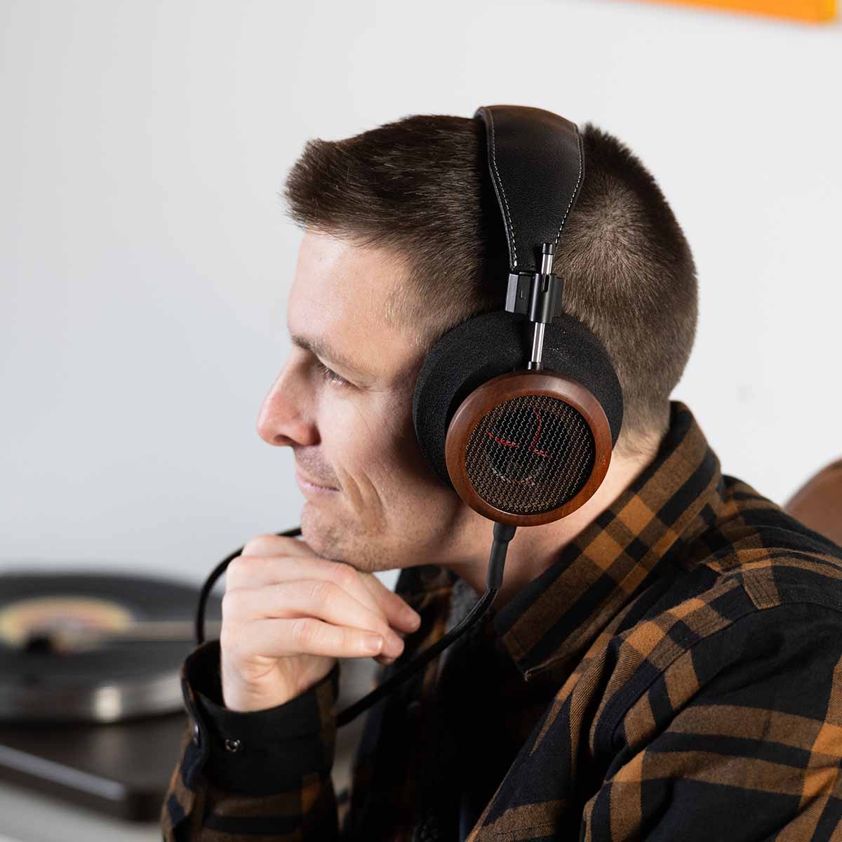 Grado Signature S950 Headphone - lifestyle shot man wearing headphones facing left