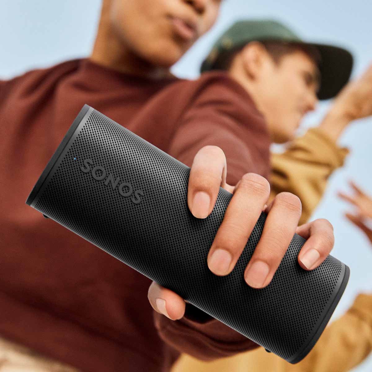 Sonos Roam 2 Portable Waterproof Smart Speaker - black - lifestyle photo person holding speaker
