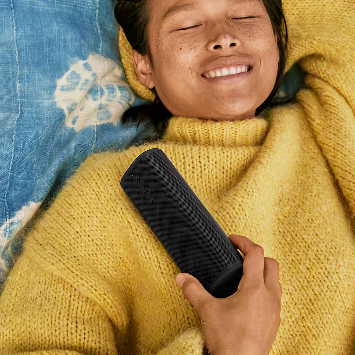 Sonos Roam 2 Portable Waterproof Smart Speaker - black - lifestyle photo person holding speaker