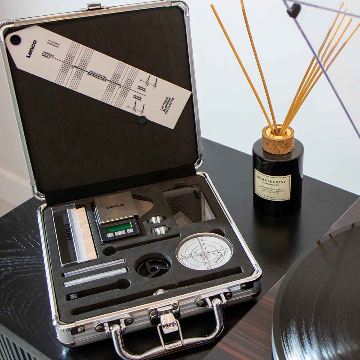Lenco TTA-12IN1PRO Professional 12-in-1 Turntable Setup and Record Cleaning Kit open case on shelf to left of record player