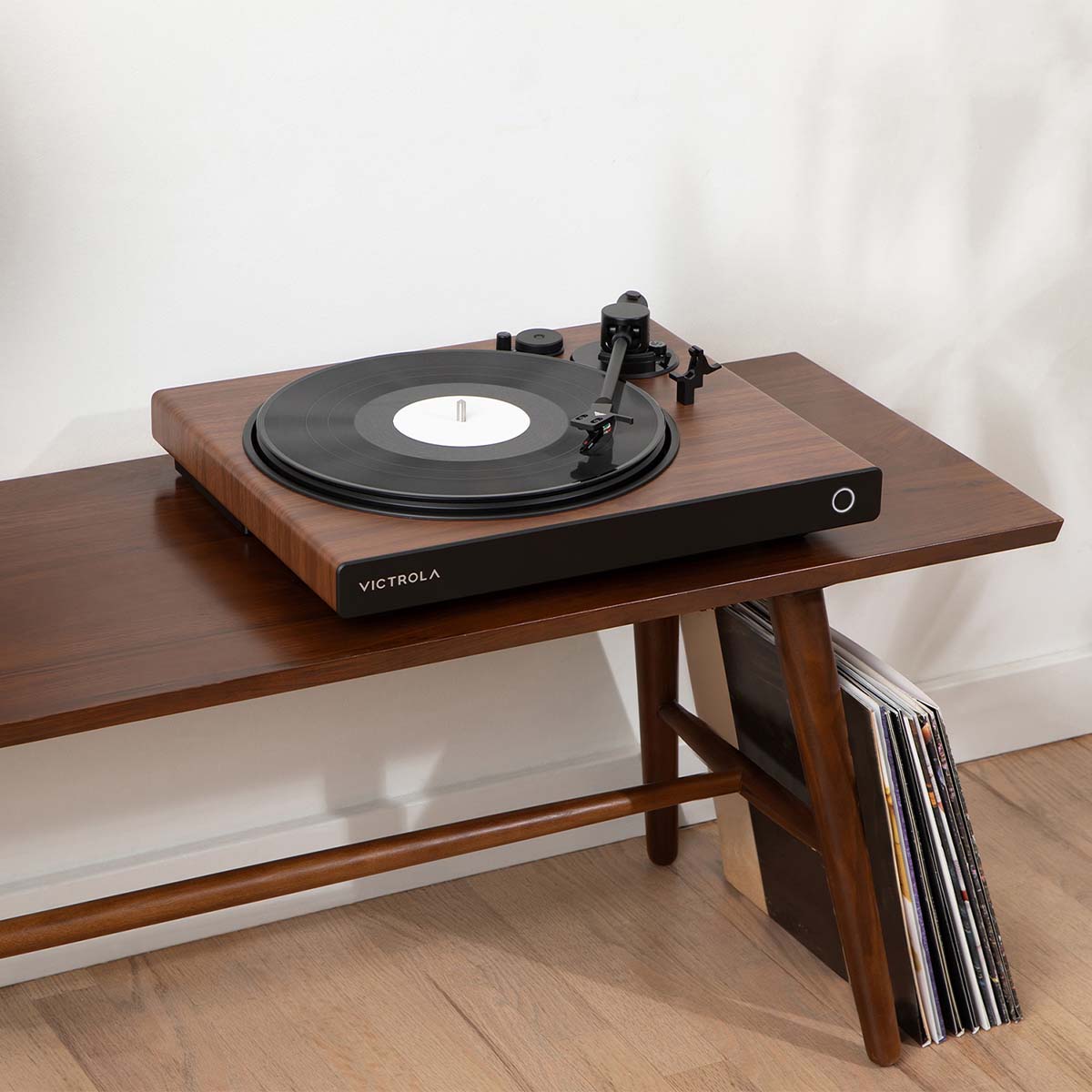 Victrola Wave Bluetooth Turntable - walnut with open dust cover - lifestyle image