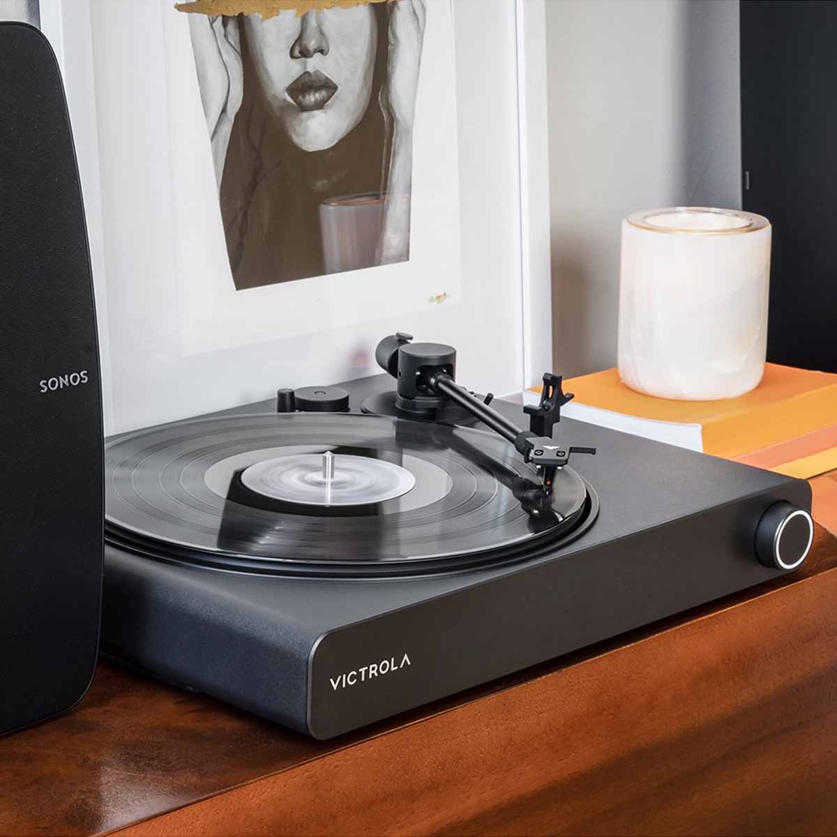 Victrola Stream Onyx Wi-Fi Streaming Turntable - Black - lifestyle view of unit on cabinet with Sonos speaker to left