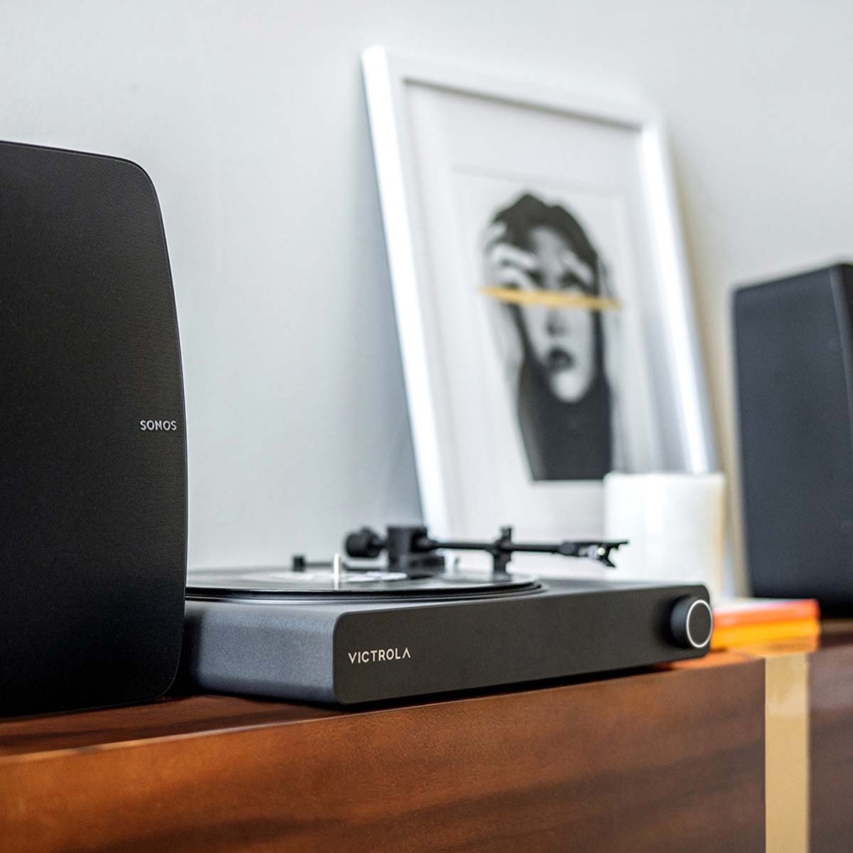 Victrola Stream Onyx Wi-Fi Streaming Turntable - Black - lifestyle view of unit on cabinet with Sonos speaker to left
