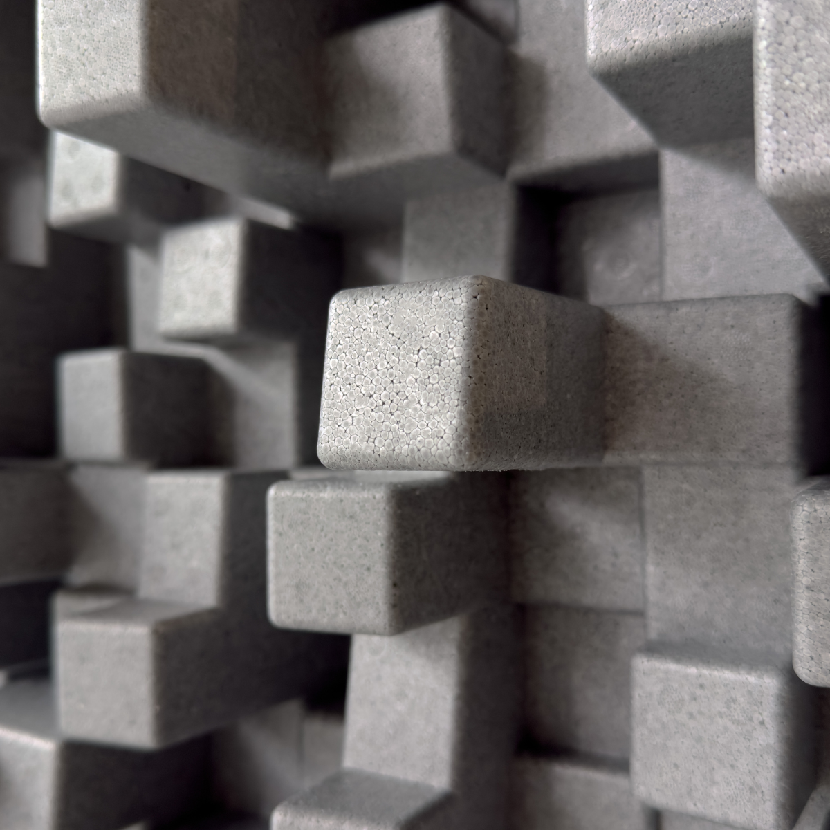Close-up of a Vicoustic Cinema Multifuser DC4 Acoustic Diffuser Panel - Box of 4 with a textured, blocky, 3D geometric design.