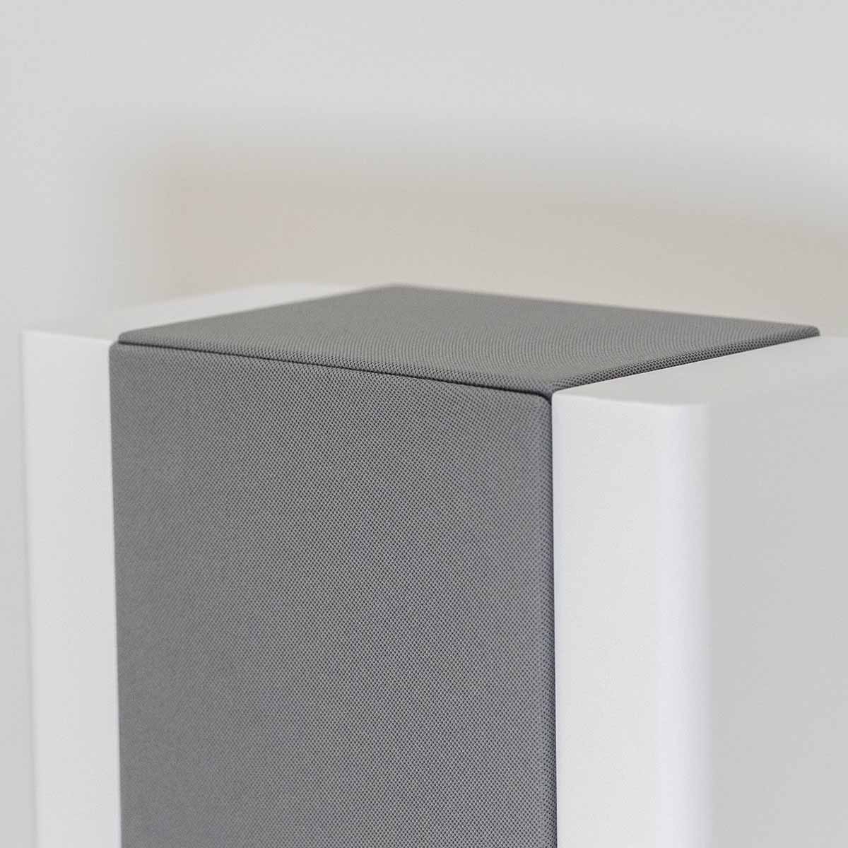 Lyngdorf FR-2 Speaker - closeup of top of white speaker with light grey grille