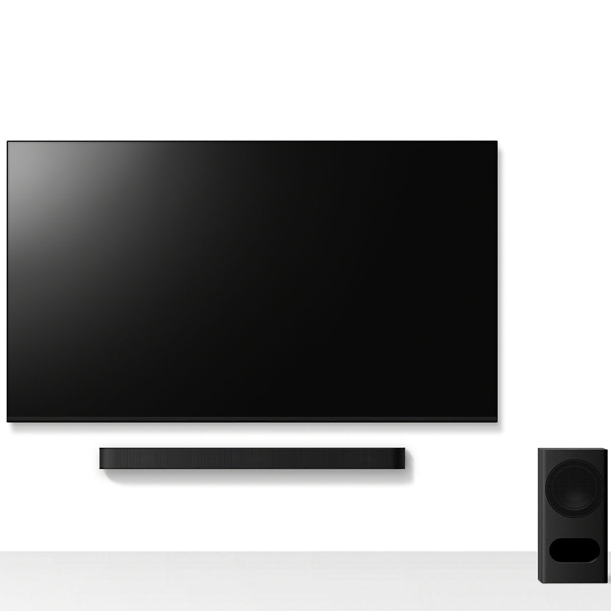 Sony BRAVIA Theater Bar 5 Soundbar front view of bar mounted under a TV with subwoofer on floor to right
