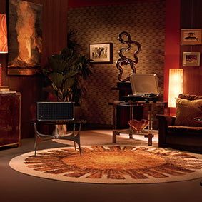 JBL Authentics Speakers on tables around a room