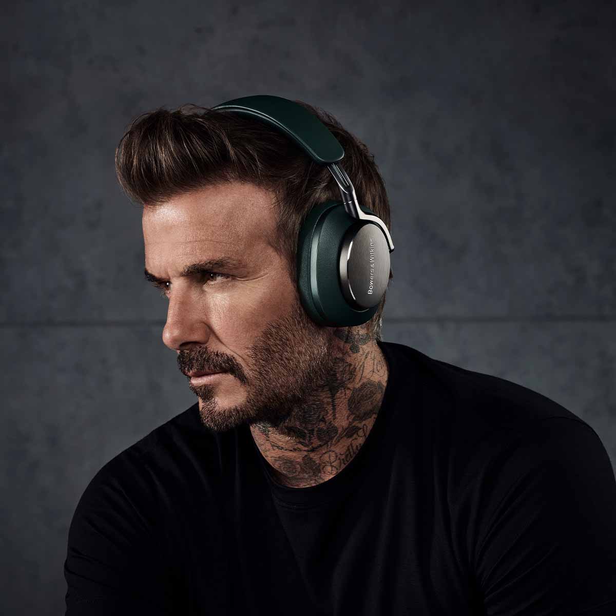 Bowers & Wilkins Px8 Wireless Over-Ear Headphones - Beckham wearing PX8 dark forest