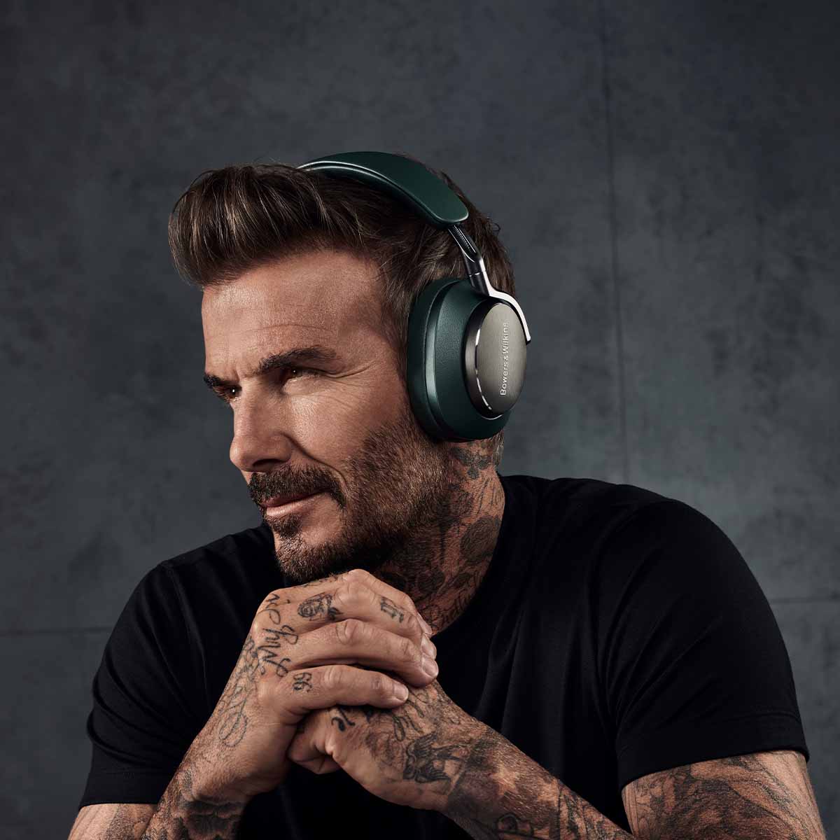 Bowers & Wilkins Px8 Wireless Over-Ear Headphones - Beckham wearing PX8 dark forest