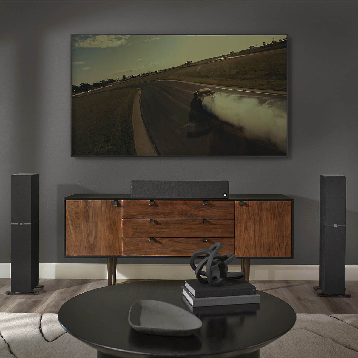 Dymension 20 Center Channel Speaker In Black Cinematic in Living Room with tower speakers