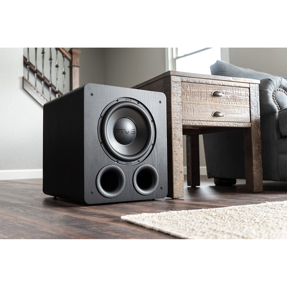 PB-2000 Pro subwoofer sitting beside table