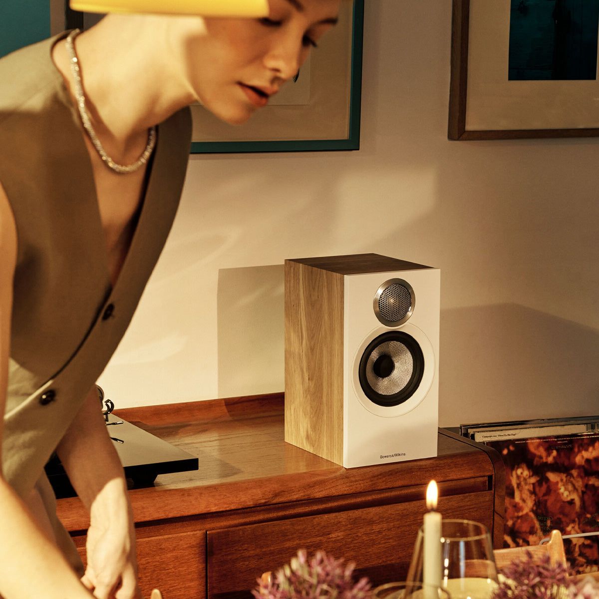 Bowers & Wilkins 607 S3 Bookshelf speaker in oak on a media cabinet