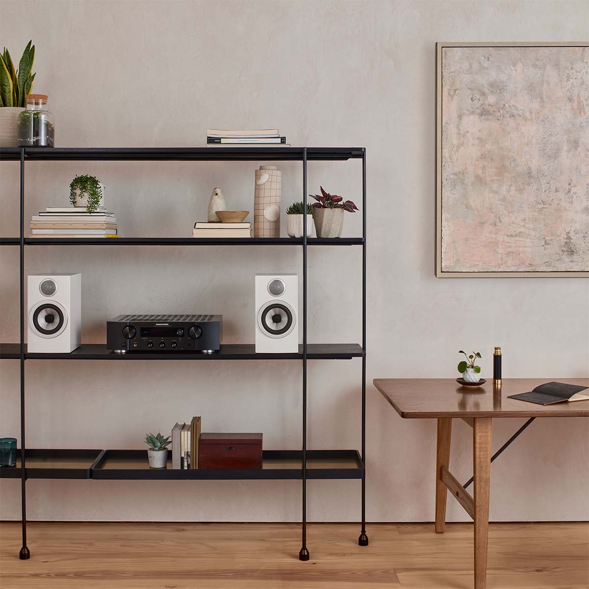 Bowers & Wilkins 707 S3 Bookshelf speakers in black and white on stands