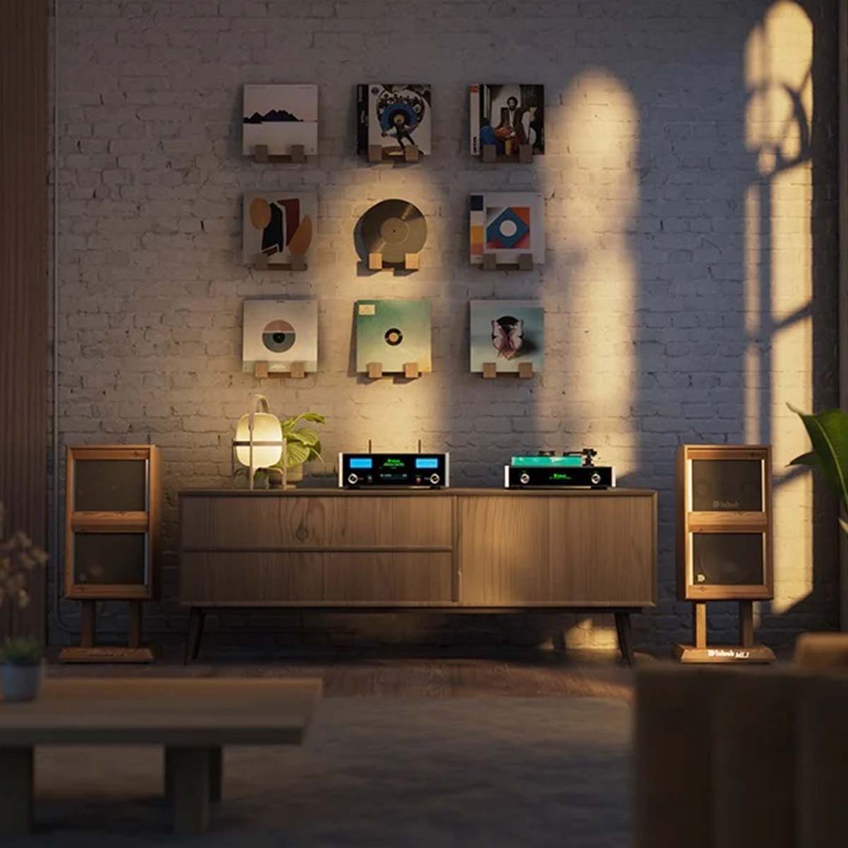 McIntosh MSA5500 Streaming Integrated Amplifier - black lifestyle front view shot on media cabinet in front of white brick wall