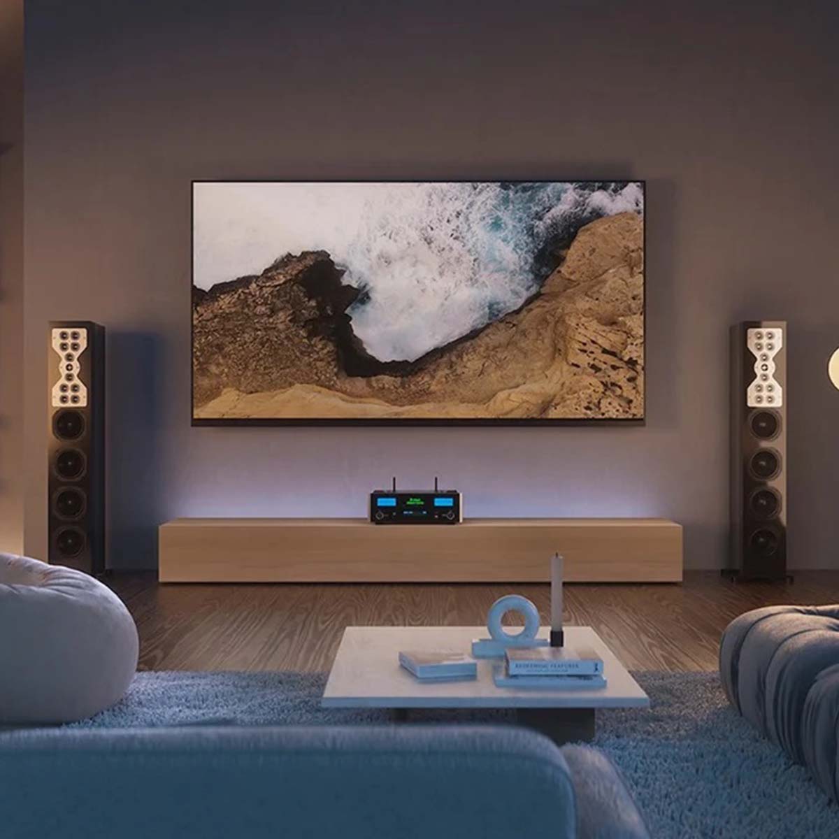 McIntosh MSA5500 Streaming Integrated Amplifier - black lifestyle front view shot on media cabinet underneath TV