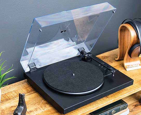 Pro-Ject Automat A1 on cabinet with dust cover up