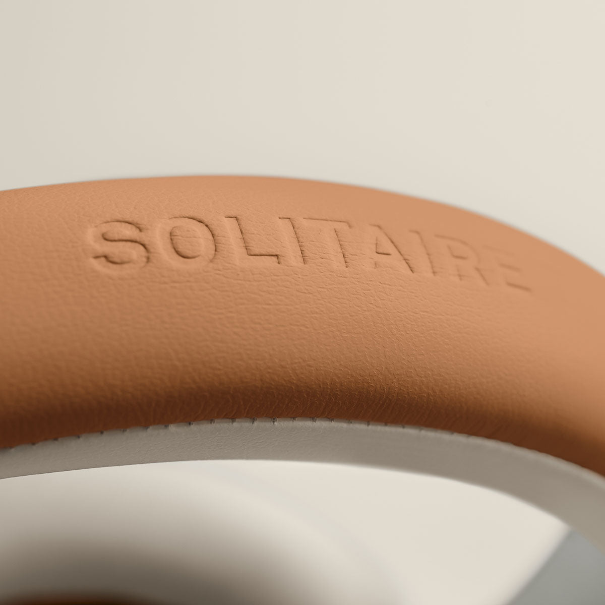T+A Solitaire T High-Performance Closed-Back Dynamic Headphones - White - detail showing Solitaire T logo