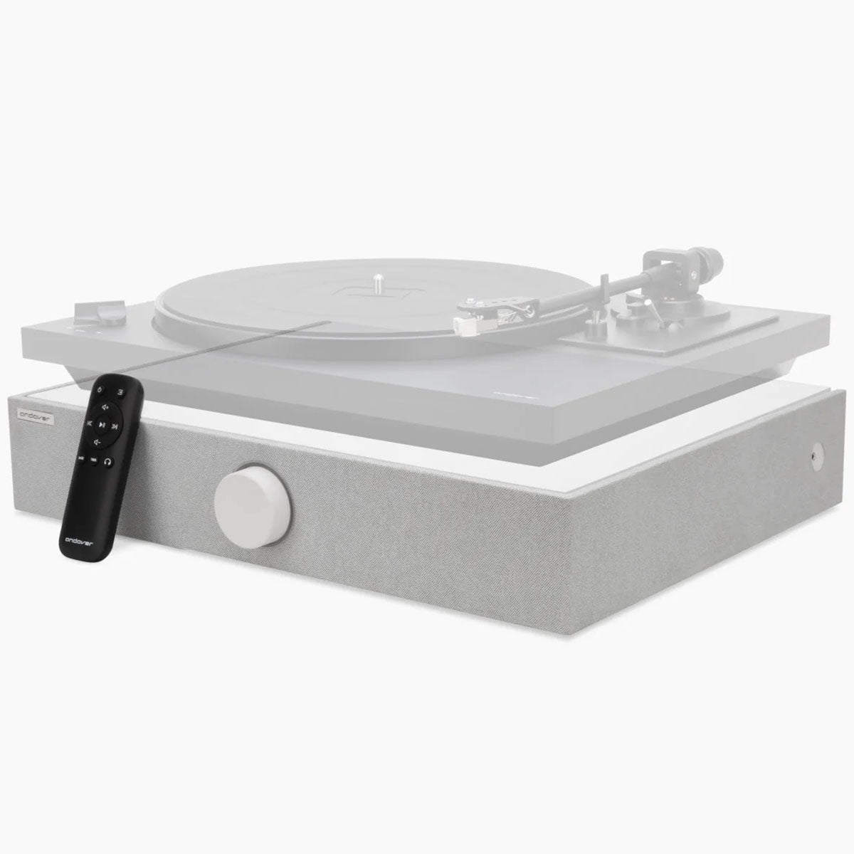 Andover SpinBase 2 Powered Turntable Speaker - white - front side and top view angled left with transparent turntable on top and remote leaning on front
