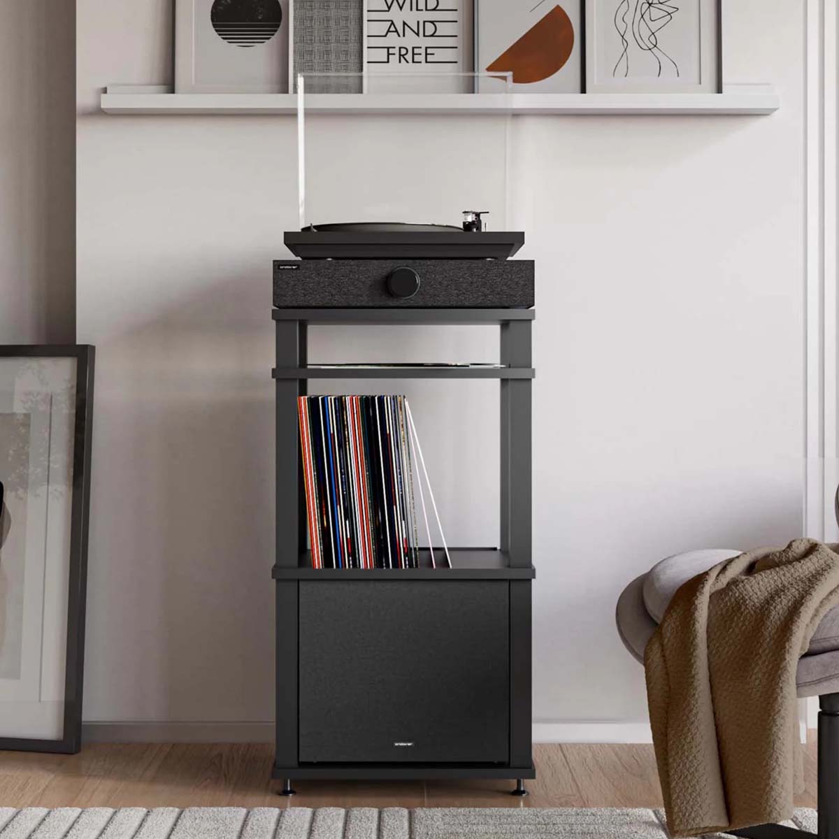 Andover SpinBase 2 Powered Turntable Speaker - black - lifestyle shot front view with turntable on top on record cabinet