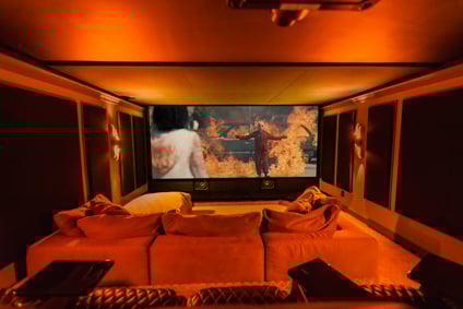 Home Theater with movie on the screen and orange glow