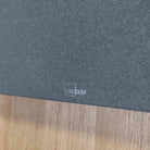 Lyngdorf SB-75 Passive Stereo Speaker Bar - lifesyle photo of unit mounted below TV closeup of Lyngdorf logo