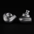 Meze Audio ASTRU Single Dynamic Driver In-Ear Monitors - artistic photo of both earbuds on black background
