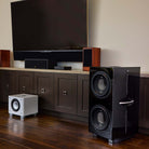 REL Acoustics 212 Black Label Subwoofer without grille lifestyle photo to right of frame
