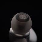 Meze Audio ASTRU Single Dynamic Driver In-Ear Monitors - artistic photo of single earbud on black background showing ear tip