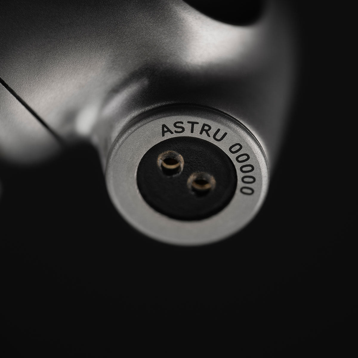 Meze Audio ASTRU Single Dynamic Driver In-Ear Monitors - artistic photo on black background detail of cable input