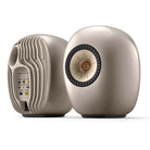 KEF LS Luxe Wireless HiFi Speakers - Pair of tan speakers angled left with left speaker showing back side