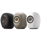 KEF LS Luxe Wireless HiFi Speakers - three speakers angled left, from left to right black, tan, white