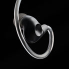 Meze Audio ASTRU Single Dynamic Driver In-Ear Monitors - artistic photo of single earbud connected to cable with eartip on black background