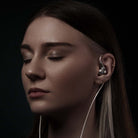 Meze Audio ASTRU Single Dynamic Driver In-Ear Monitors - woman facing left with eyes closed wearing earbuds