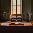 Bowers & Wilkins 801 D5 Floorstanding Loudspeaker - lifestyle photo of Light Walnut speakers without grilles in living room with hi-fi system in between