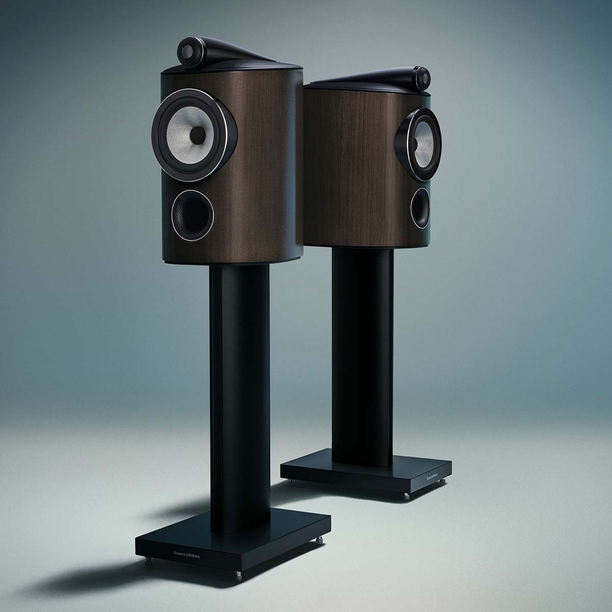 Bowers & Wilkins 805 D5 Bookshelf Loudspeaker - pair of Dark Walnut speakers on stands without grilles facing opposite directions
