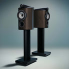 Bowers & Wilkins 805 D5 Bookshelf Loudspeaker - pair of Dark Walnut speakers on stands without grilles facing opposite directions