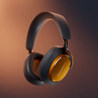 Bowers & Wilkins Px8 S2 McLaren Edition Wireless Over-Ear Headphones - front view angled left on orange background