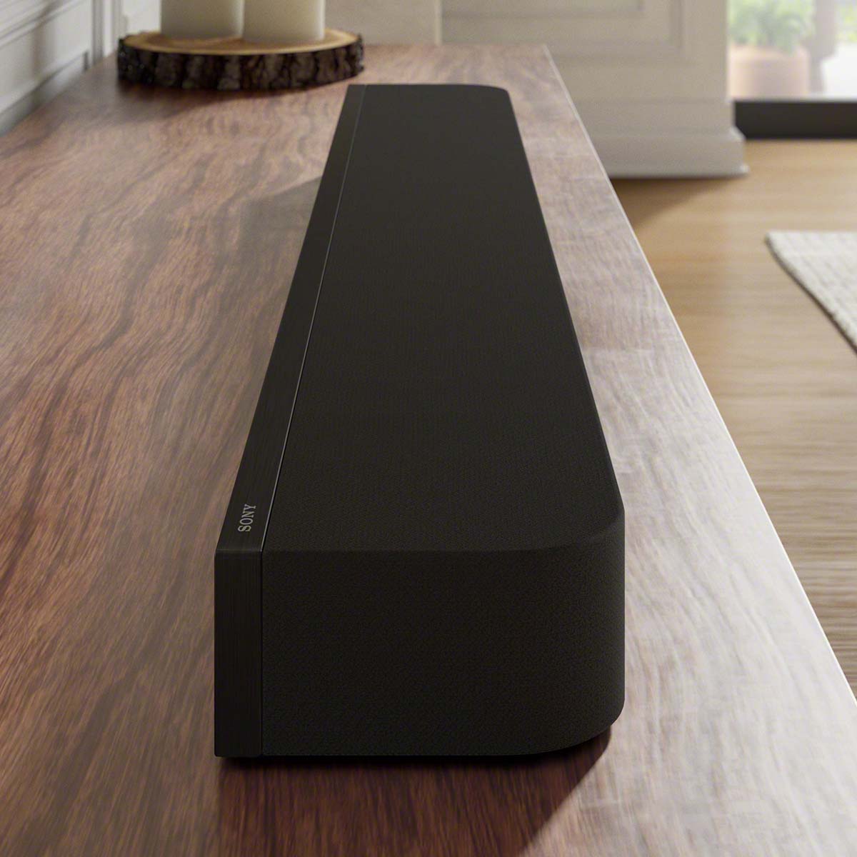 Sony BRAVIA Theater Bar 7 Soundbar lifestyle view of soundbar soundbar on cabinet side and top view facing right