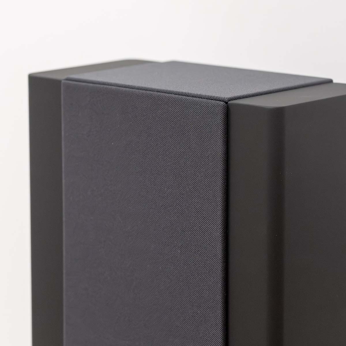 Lyngdorf FR-2 Speaker - closeup of top of black speaker with black grille