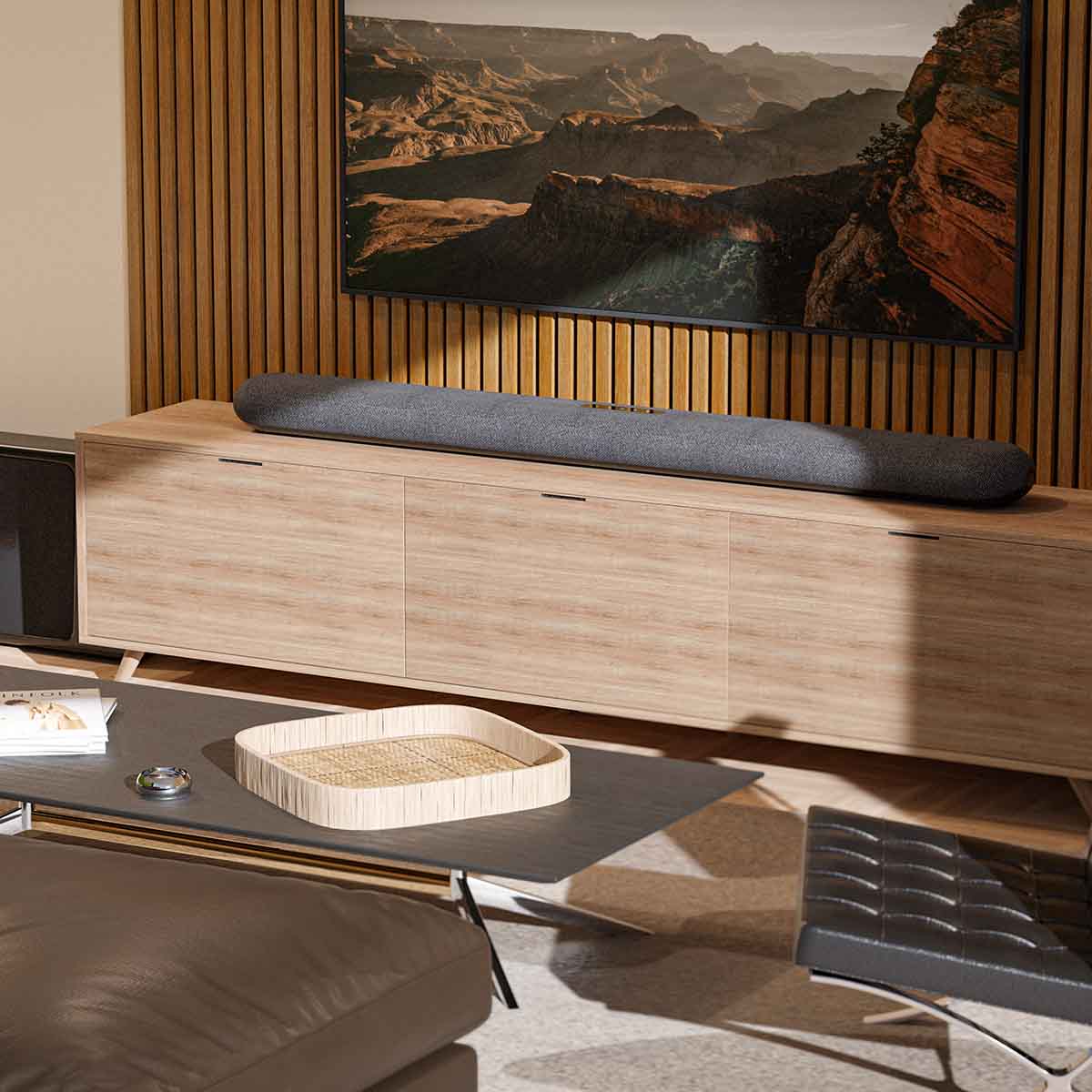 Bluesound Pulse Cinema Multi-Room Streaming Soundbar lifestyle photo of unit on cabinet under TV