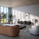 Lyngdorf Cue-100 Speaker lifestyle photo of speakers in living room, pair of white speakers with oak base and no grilles