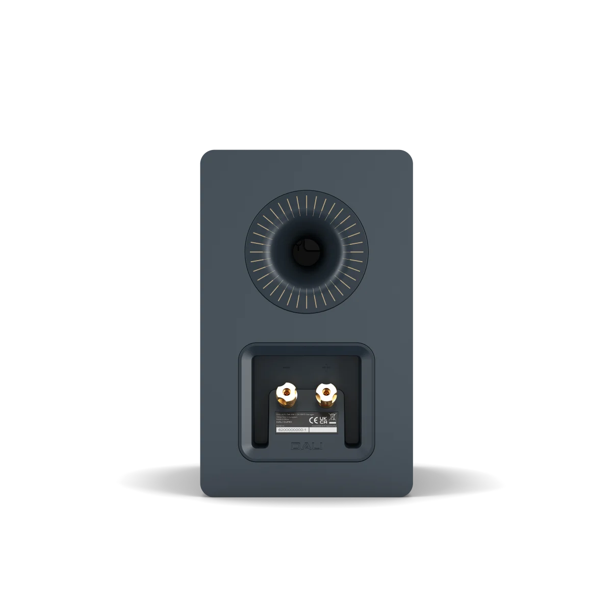 The rear view of a dark slate blue/gray speaker showing the dual banana plug input jacks and a circular dial detail, on a clean white background.