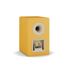 A single DALI KUPID bookshelf speaker in a matte mustard yellow finish, shown from a three-quarter angle on a clean white background.