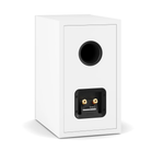 A white Dali Sonik 3 bookshelf speaker shown from the rear, featuring a circular black port and a black terminal plate with gold-colored screw terminals, set against a plain white background.