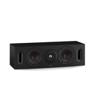 A black Dali center-channel speaker with two large woofers, a central tweeter, and side porting holes, shown against a plain white background.