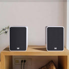 Wharfedale Denton 1S Speaker - pair of matte white with grille - lifestyle image