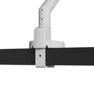 Close-up of a Kanto DM1 Single Monitor Desktop Mount for 17” - 40” Displays holding a black desk on a white background