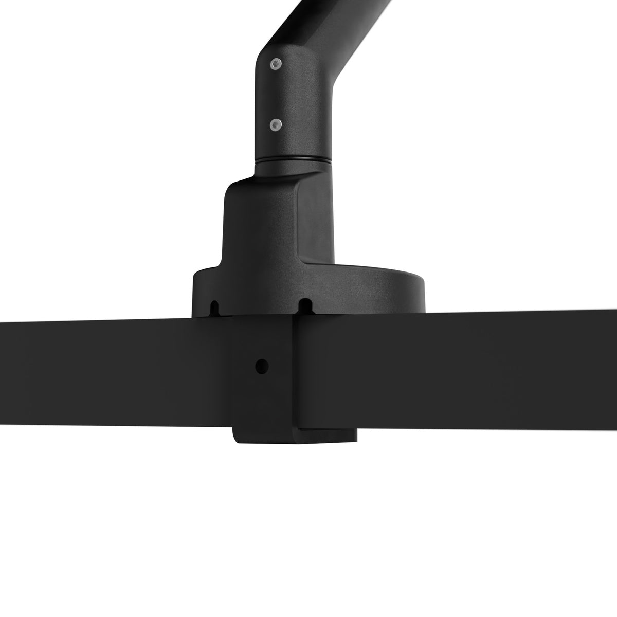 Close-up of a black ceiling-mounted lamp fixture on a white background