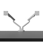Two adjustable monitor stands on a white background